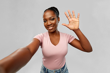 Image showing happy african american woman taking selfie