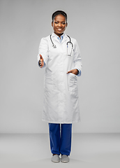 Image showing african american female doctor making handshake