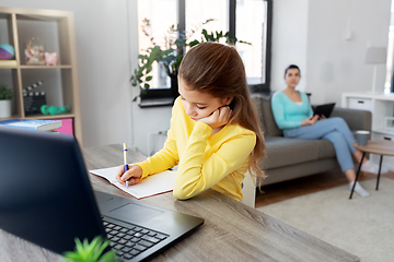 Image showing student girl with laptop learning online at home