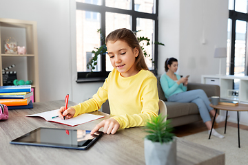 Image showing student girl with tablet pc learning at home