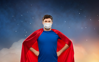 Image showing superhero man in face protective mask at night