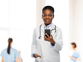 Image showing african american female doctor with smartphone