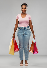 Image showing happy african american woman with shopping bags