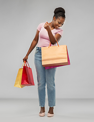 Image showing happy african american woman with shopping bags