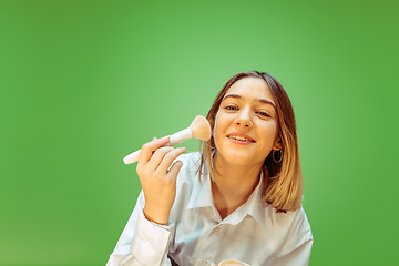 Image showing Teen girl dreaming about future profession of makeup artist