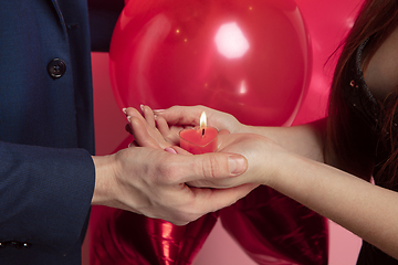 Image showing Valentine\'s day celebration, happy caucasian couple isolated on coral background