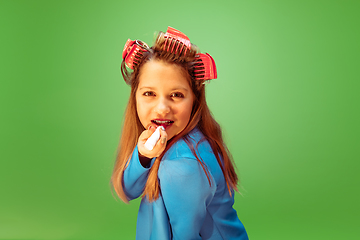 Image showing Teen girl dreaming about future profession of makeup artist