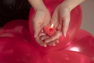 Image showing Valentine\'s day celebration, happy caucasian couple isolated on coral background