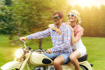 Image showing beautiful couple on retro motorbike