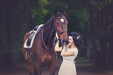 Image showing beautiful girl in dress with horse