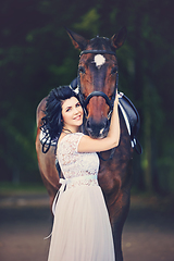 Image showing beautiful girl in dress with horse