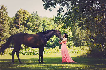 Image showing beautiful girl in dress with horse