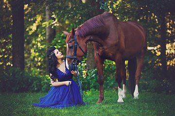 Image showing beautiful girl in dress with horse