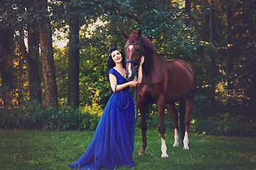 Image showing beautiful girl in dress with horse