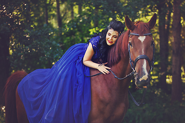 Image showing beautiful girl in dress with horse