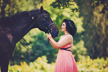 Image showing beautiful girl in dress with horse