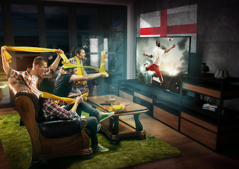 Image showing Group of friends watching TV, sport concept, leisure activity