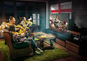 Image showing Group of friends watching TV, sport concept, leisure activity