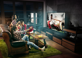 Image showing Group of friends watching TV, sport concept, leisure activity