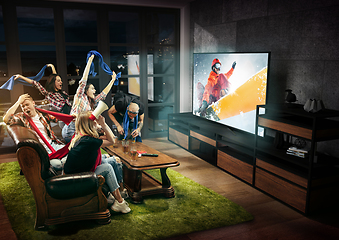 Image showing Group of friends watching TV, sport concept, leisure activity