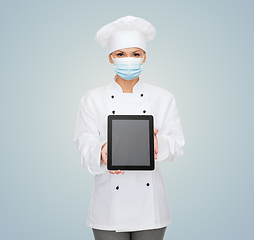 Image showing female chef in face mask with tablet pc computer