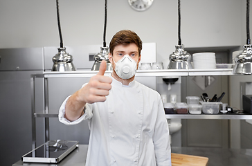 Image showing male chef with in respirator at restaurant kitchen