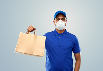 Image showing delivery man in respirator mask with paper bag
