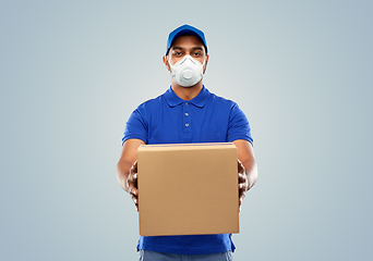 Image showing indian delivery man with parcel box in respirator