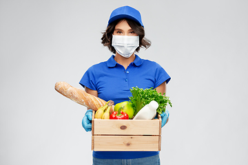 Image showing delivery woman in face mask with food in box