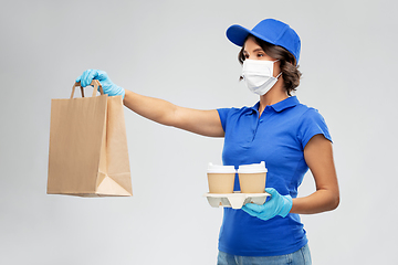 Image showing delivery woman in face mask with food and drinks