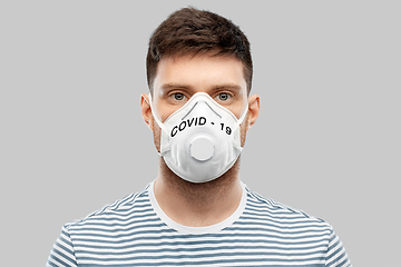 Image showing young man in face protective mask or respirator