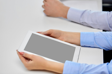 Image showing close up of businesswoman with tablet pc at office