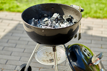 Image showing charcoal smoldering in brazier outdoors