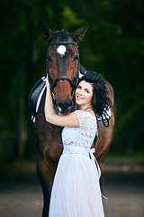 Image showing beautiful girl in dress with horse