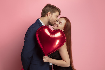 Image showing Valentine\'s day celebration, happy caucasian couple isolated on coral background