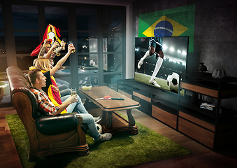 Image showing Group of friends watching TV, sport concept, leisure activity