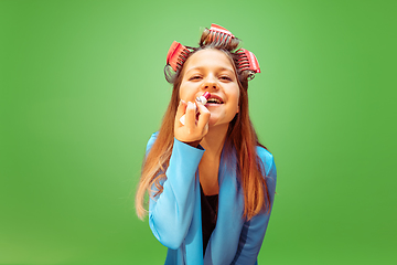 Image showing Teen girl dreaming about future profession of makeup artist