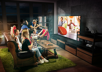 Image showing Group of friends watching TV, sport concept, leisure activity