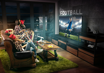 Image showing Group of friends watching TV, sport concept, leisure activity