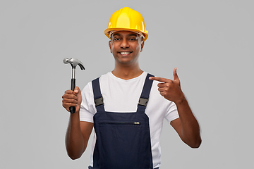 Image showing happy smiling indian worker or builder with hammer