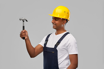 Image showing happy smiling indian worker or builder with hammer