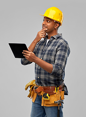 Image showing thinking indian builder in helmet with tablet pc