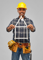 Image showing happy indian builder with ruler in shape of home