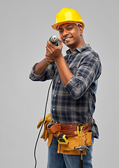 Image showing happy indian builder in helmet with electric drill