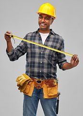 Image showing happy indian worker or builder with ruler