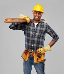 Image showing happy indian worker or builder with wooden boards