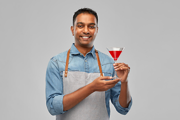 Image showing indian barman in apron with glass of cocktail