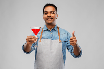 Image showing indian barman in apron with glass of cocktail