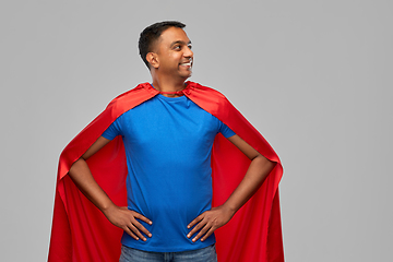 Image showing happy smiling indian man in red superhero cape