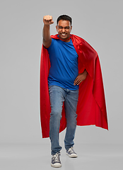 Image showing indian man in superhero cape makes winning gesture